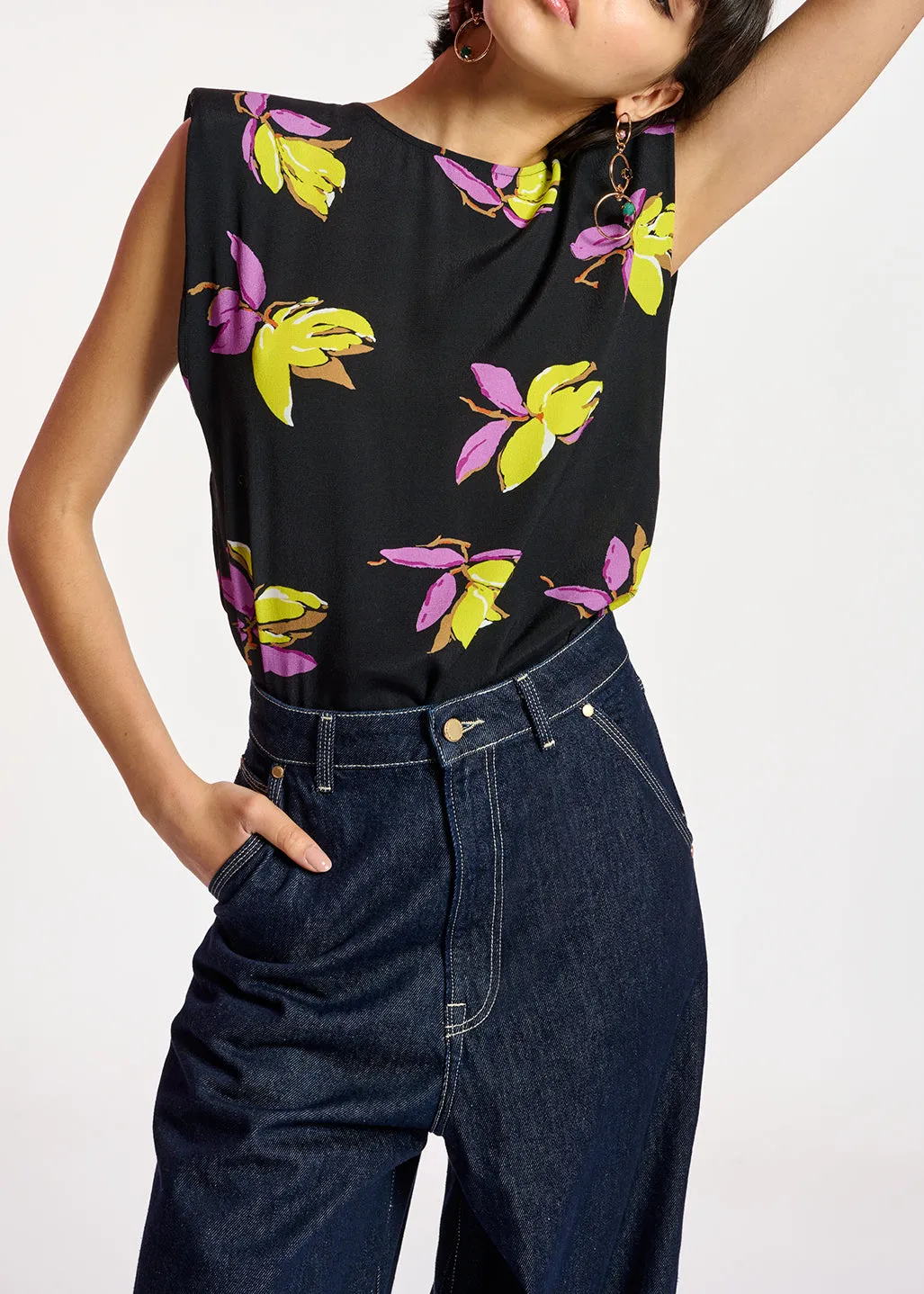 Black floral-print sleeveless top with padded shoulders