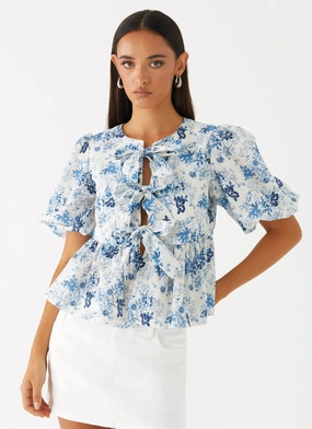 Moisture Wicking Technology Western Wind Tie Top - Serene Sky Floral Western Wind Tie Top - Serene Sky Floral AthleticInspired WrinkleFree Structure