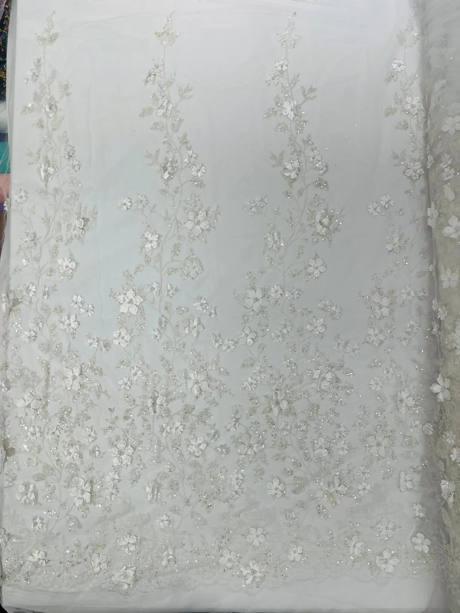 Princess Glitter 3d floral design embroidery with pearls in a mesh lace-sold by the yard.