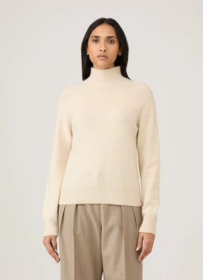 Reinforced Cuff Architecture Women's Lambswool Funnel Neck Jumper in Ecru Women's Lambswool Funnel Neck Jumper in Ecru Recycled Polyester Blend Sustainable Manufacturing
