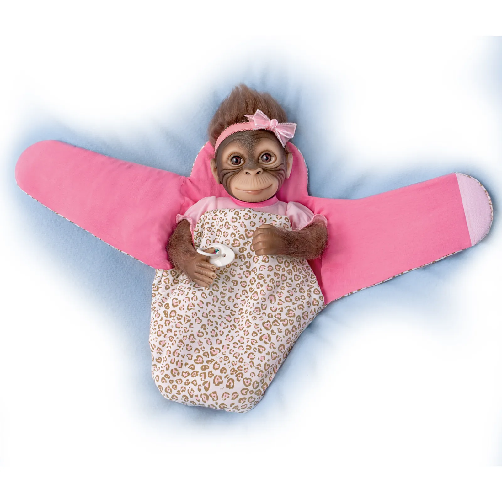 The Ashton - Drake Galleries Snuggle Suri Lifelike Baby Monkey Girl Doll With RealTouch® Vinyl Skin and Weighted Cloth Body Hand Applied Mohair Magnetic Pacifier Leopard Print Bunting 14"-inches