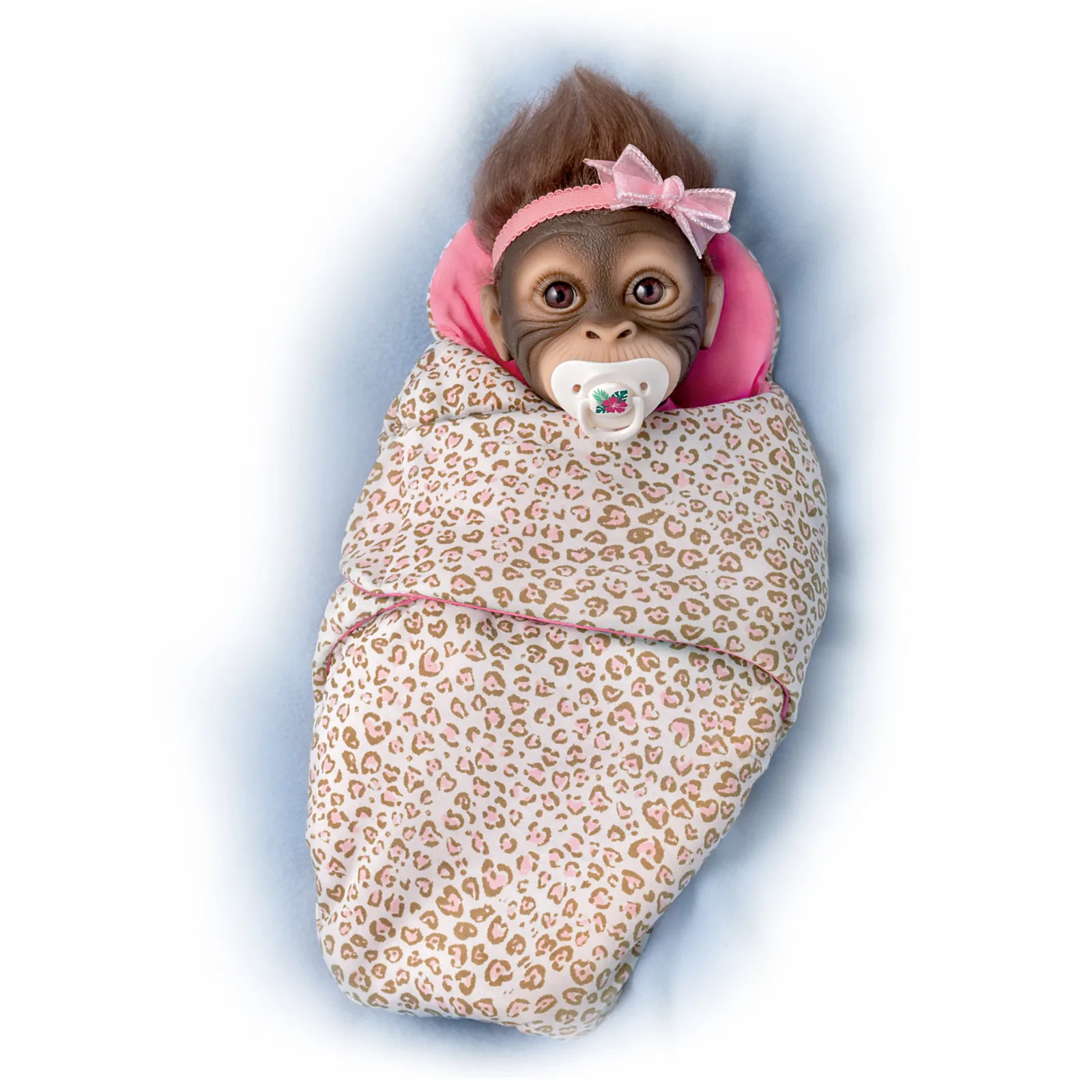 The Ashton - Drake Galleries Snuggle Suri Lifelike Baby Monkey Girl Doll With RealTouch® Vinyl Skin and Weighted Cloth Body Hand Applied Mohair Magnetic Pacifier Leopard Print Bunting 14"-inches
