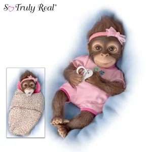 The Ashton - Drake Galleries Snuggle Suri Lifelike Baby Monkey Girl Doll With RealTouch® Vinyl Skin and Weighted Cloth Body Hand Applied Mohair Magnetic Pacifier Leopard Print Bunting 14"-inches