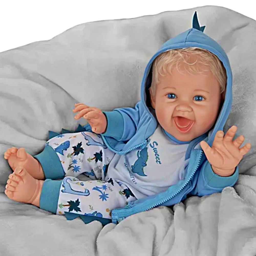 The Ashton-Drake Galleries Sweet Snugglesaurus Baby Collectible Doll Realistic Reborn with RealTouch® Vinyl Giggles and Roars Hand-Rooted Hair Weighted Body and Dinosaur Outfit by Ping Lau 17-inches